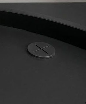 A capped, pre-drilled cable port in the Carbon desktop